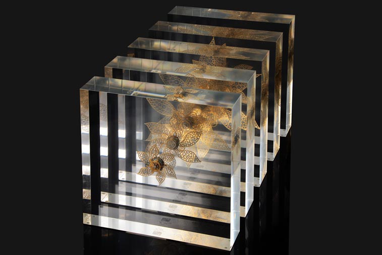 Lucite embedded stainless steel mechanical flower sculpture