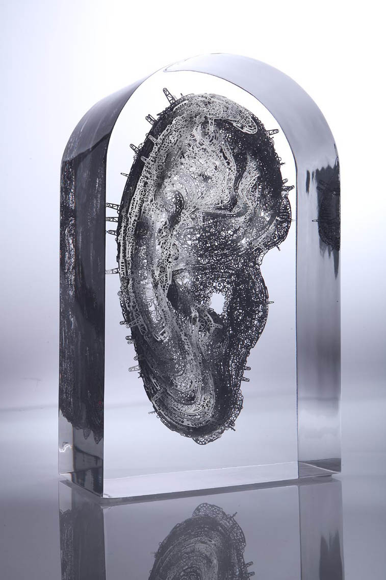 Lucite embedded stainless steel layered mechanical ear sculpture
